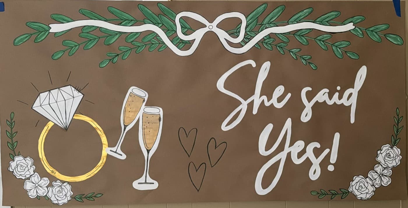 Hand-painted engagement celebration banner